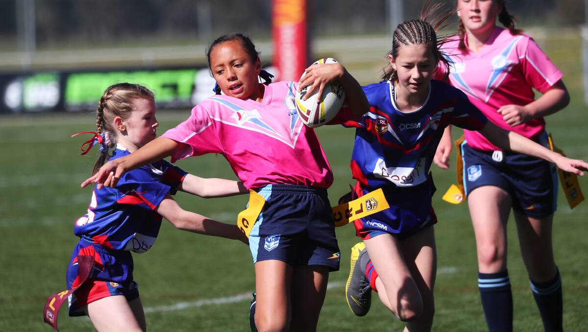MAKING A MOVE: Rain Te-Huinga Dodd looks to avoid being tagged during the under 12s grand final last season. Group Nine Junior League are looking to start a non-competitive season on July 18.