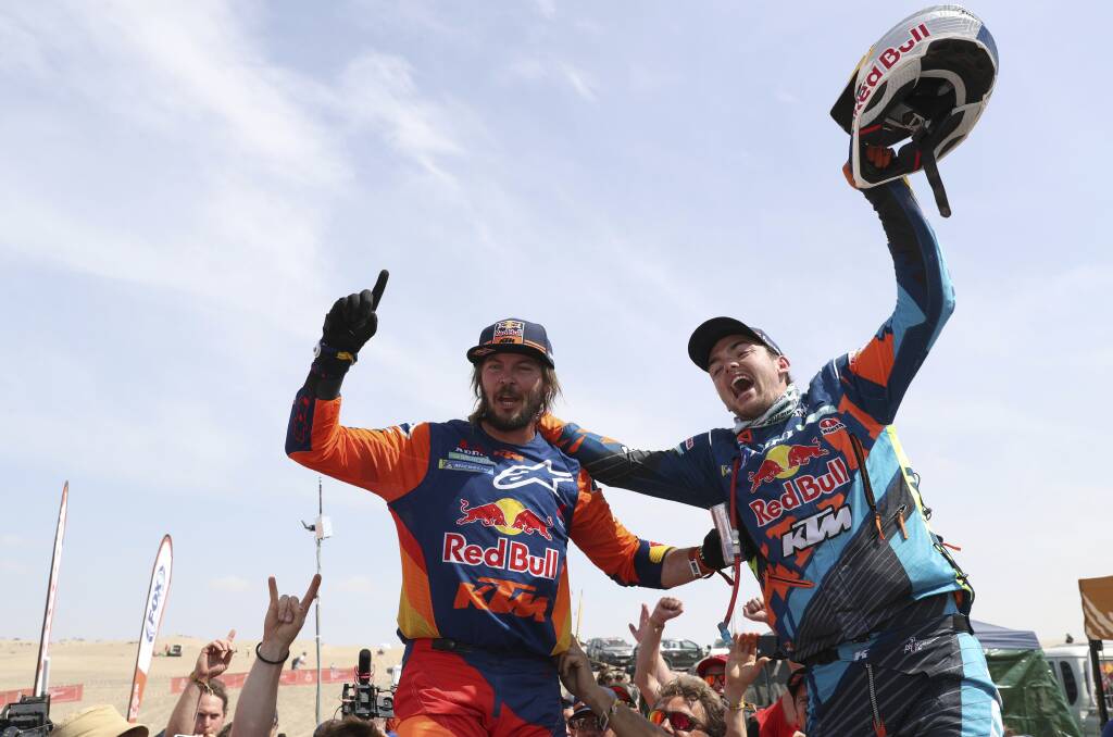 PRIDE OF HILLSTON: Toby Price celebrates with Austria's Matthias Walkner after claiming victory in the Dakar Rally in Peru on Friday morning.