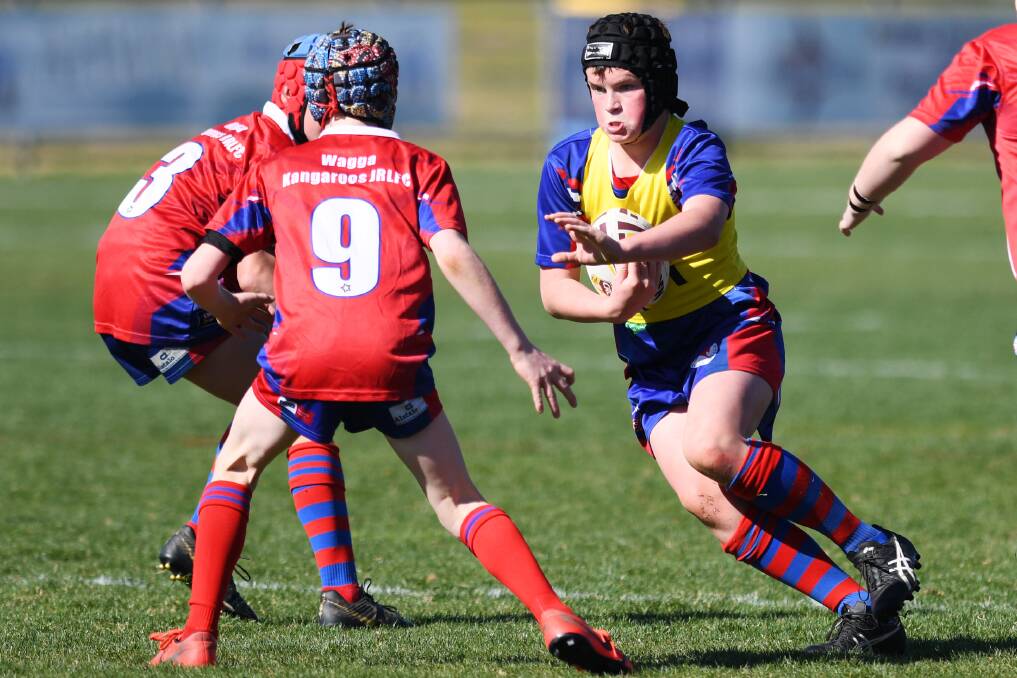 BACK ON DECK: Jude Cattle charges forward during the all Kangaroos under 14s grand final last season. The junior competition is expected to start in July due to the coronavirus.
