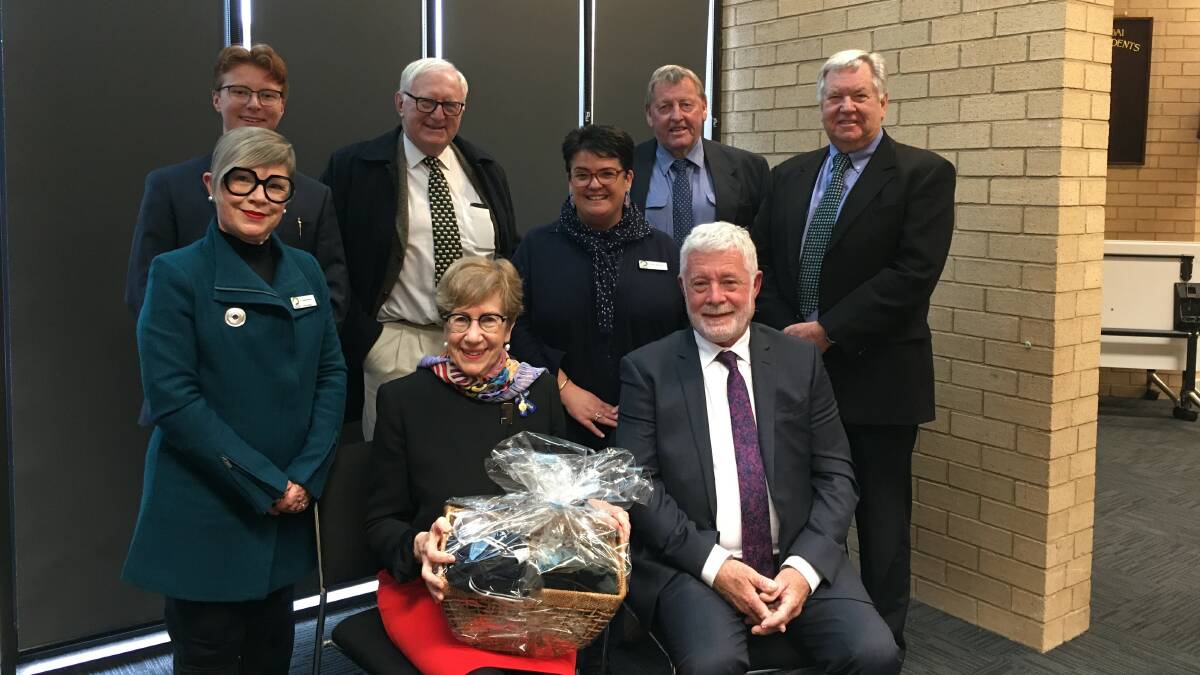 Her Excellency, Margaret Beazley AC QC, New South Wales Governor, (seated), with CGRC mayor Cr Charlie Sheahan, with the gift basket of local produce. Left to right, Cr Leigh Bowden, Cr Logan Collins, Mr Dennis Wilson, Cr Penny Nicholson, Cr Abb McAlister and CGRC Interim General Manager Mr Les McMahon.