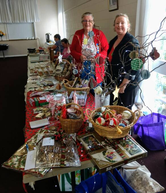 President Margaret Thornhill with Liz Hyatt with some of the handicraft from last year's day.