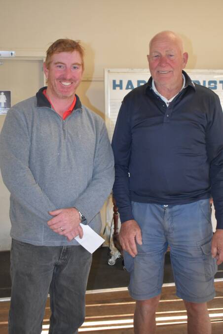HAPPY GOLFERS: Dan McGrath receives his prize from Ron Page at the golf club. Picture: Jody Potts