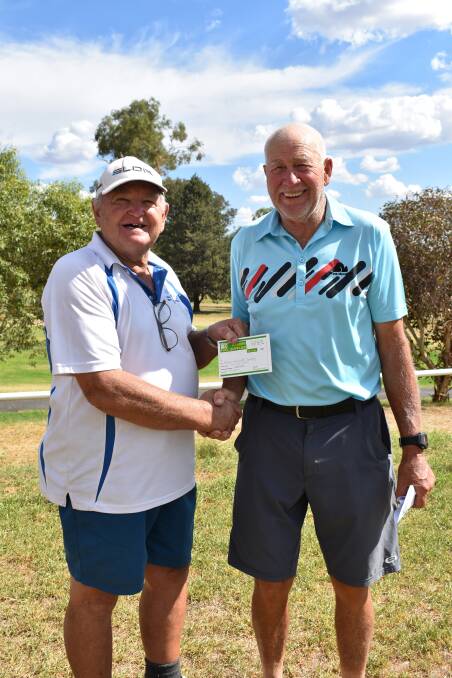 ONE TO REMEMBER: Ron Page (right) congratulates Darryl Cassidy on his impressive round. Picture: Jody Potts