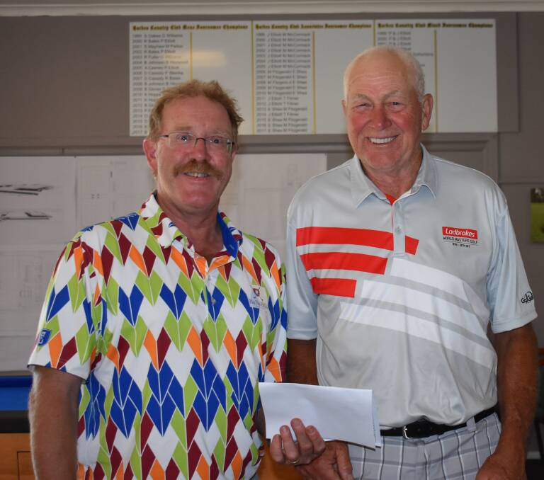COLOURFUL PAIR: Craig Filmer congratulates Ron Page on taking out the ball comp on 40 points as runner-up to Darrell Cassidy. Picture: Jody Potts 