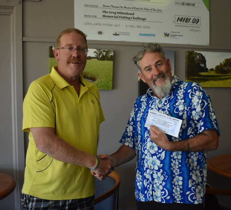 HAPPPY DAYS: Craig Filmer presents a happy John Brownhill with his winnings. Picture: Jody Potta