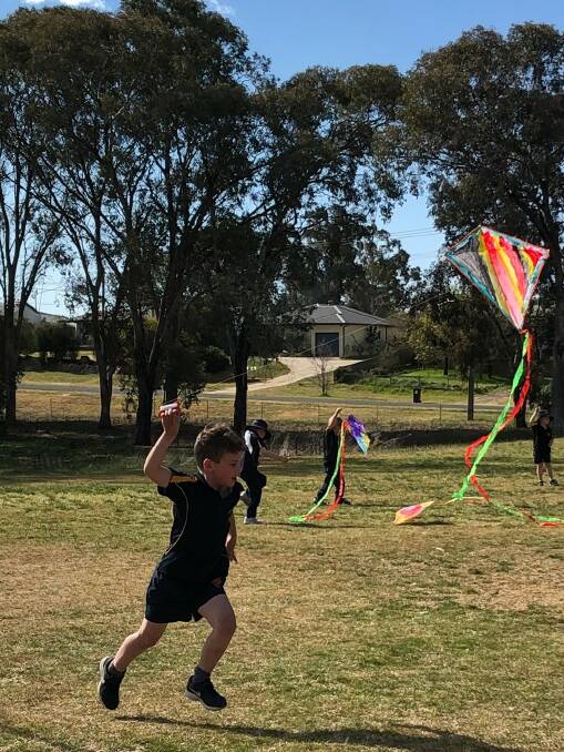 FLYING HIGH: Harden school students decorate kites in the lead-up to next weekend's Kite Festival. Picture: Contributed