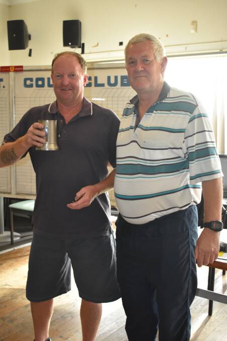 WELL DONE: Ron Fuller Jnr celebrates his winning the A Medal, A Scratch, and Guzzler’s Mug with Kevin Hoppe at the golf club. Picture: Jody Potts