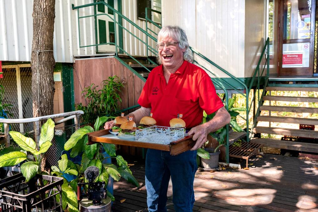 Kai Hansen bringing out his buffalo burgers at his bar on Goat Island.