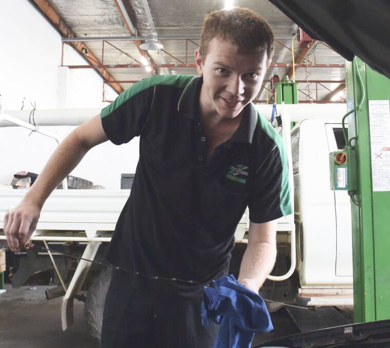 LOCAL BUSINESS: Tom Pearson, the lead mechanic at Wagga's Ultra Tune, works on a customer's car. Picture: Jody Lindbeck