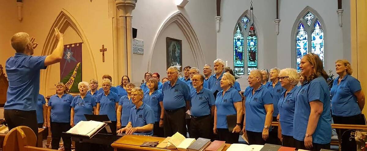 BACK IN SONG: Hilltops Choir in full voice at the Hark Hallelujah concert in St John’s Anglican Church, Young, at Christmas time.
