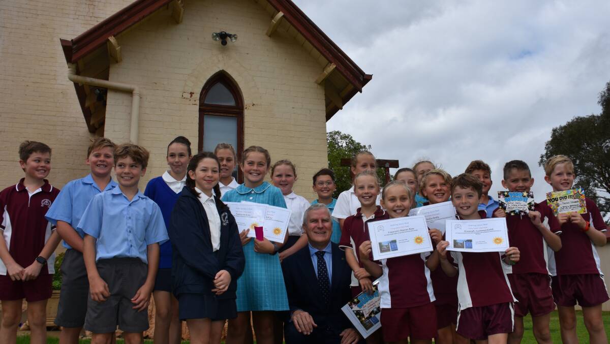 Riverina MP and Deputy Prime Minister Michael McCormack with students from Murrumburrah's Trinity Catholic Primary School on Friday morning. Photo: Peter Guthrie