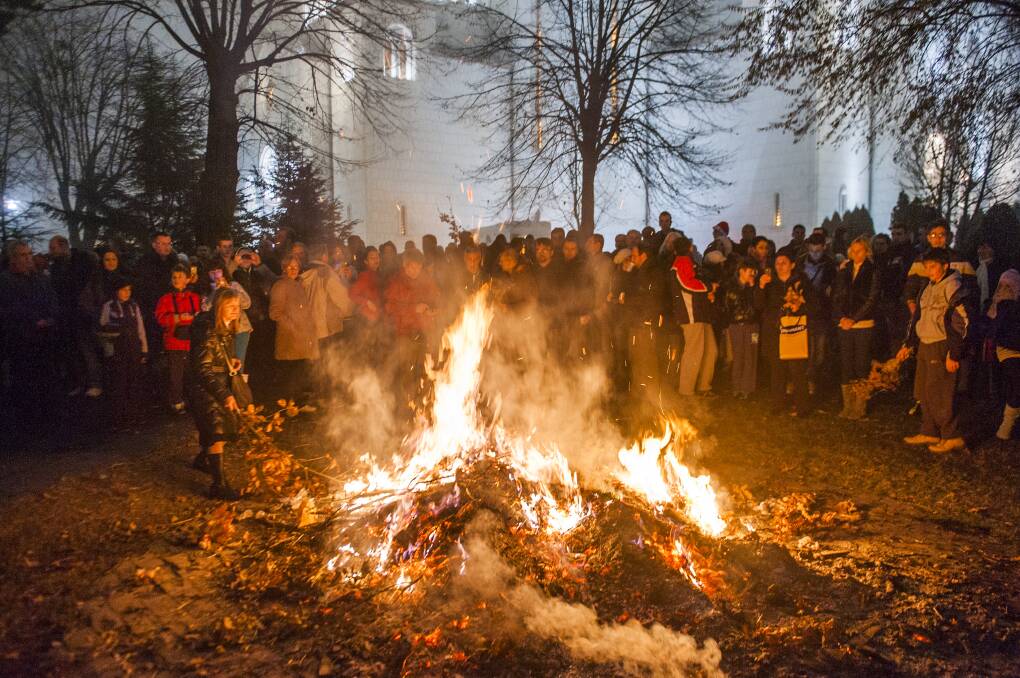 People watch a ceremonial burning of dried oak branches in Belgrade, Serbia. Picture: Shutterstock