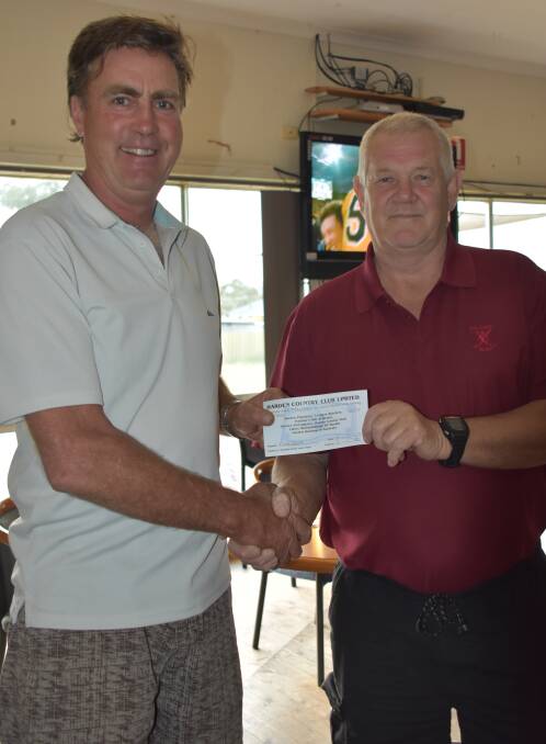 CAREER BEST: Michael Baldry is presented with first prize by Kevin Hoppe after firing 80 off the stick in Saturday's individual stableford. Picture: JODI POTTS
