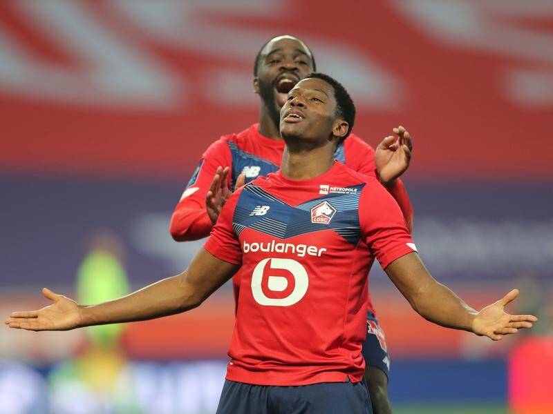 Lille's Jonathan David celebrates his second goal against Marseille in their French league clash.
