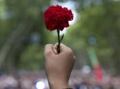 Red carnations were the symbol of Portugal's uprising in 1974 . (AP PHOTO)