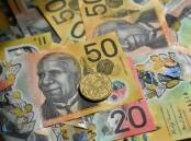 An analyst predicts a near-$10 billion improvement in the bottom line in the mid-year budget update. Photo: James Ross/AAP PHOTOS