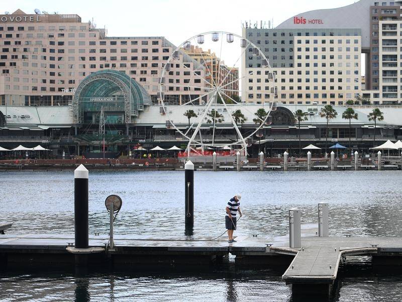 A woman who worked at quarantine hotels in Sydney's Darling Harbour has tested positive to COVID-19.