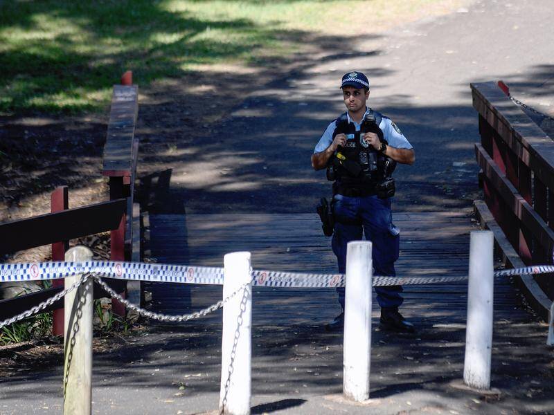 A crime scene has been set up where a burnt-out car and woman's body were found in Sydney. Photo: Steven Saphore/AAP PHOTOS A crime scene has been set up where a burnt-out car and woman's body were found in Sydney. Photo: Steven Saphore/AAP PHOTOS