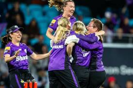 The Hobart Hurricanes celebrate their brilliant triumph in the WBBL final over the Perth Scorchers. Photo: Linda Higginson/AAP PHOTOS
