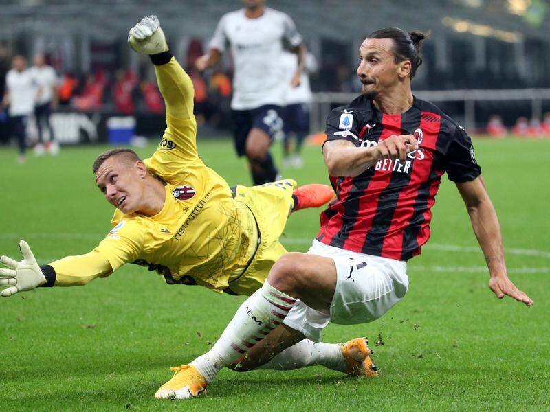 Zlatan Ibrahimovic (r) has scored twice for AC Milan against Bologna in Italy's Serie A.