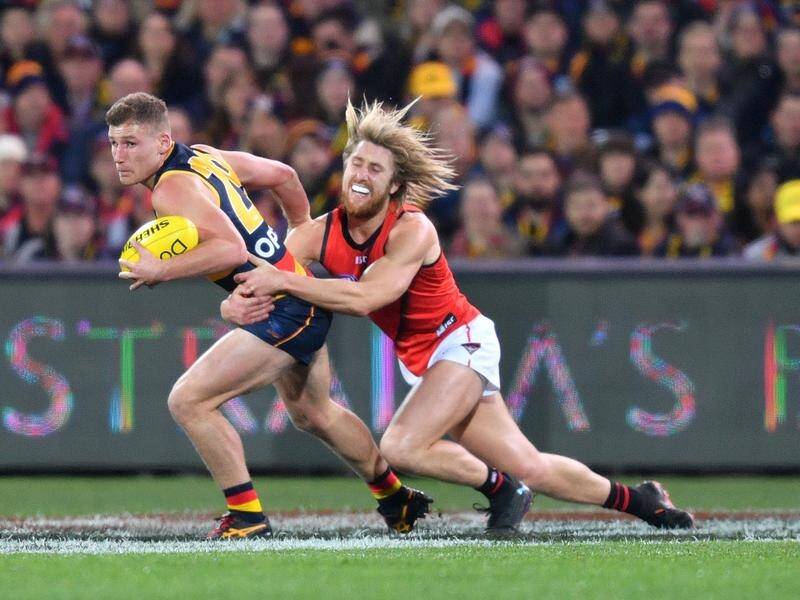 Essendon skipper Dyson Heppell (r) is in doubt for Sunday's clash with Gold Coast.