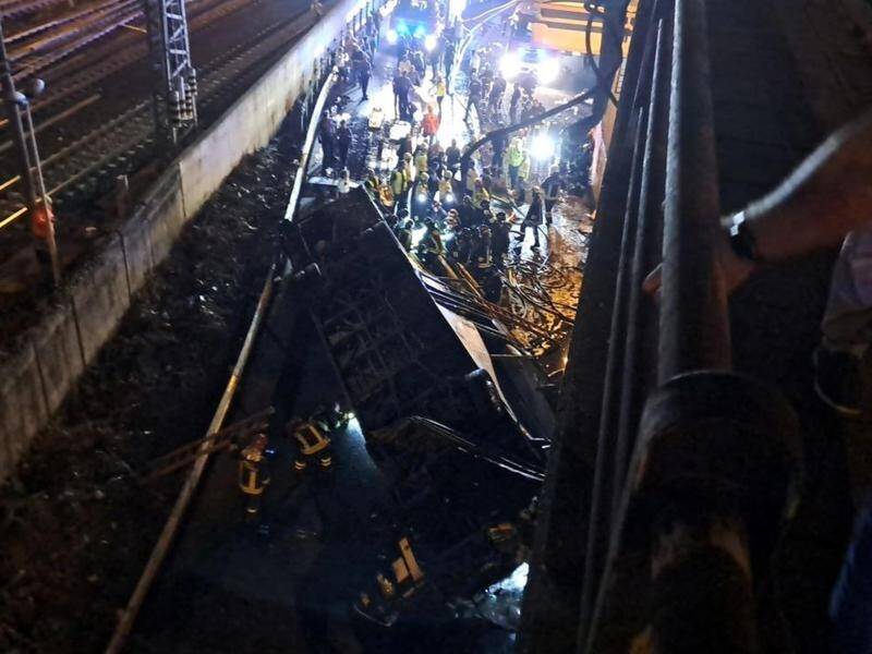 A passenger bus bus with has fallen from an elevated section in Mestre, killing more than 20 people. (EPA PHOTO)