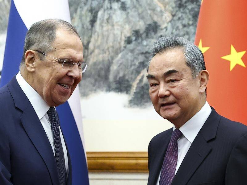 Russian Foreign Ministry Press Service Lavrov spoke with his Chinese counterpart Wang Yi in Beijing. (AP PHOTO)
