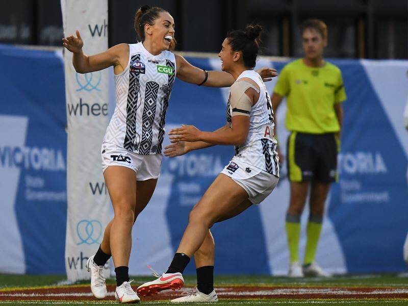 Aishling Sheridan (l) has landed two of Collingwood's goals in their AFLW win over Carlton.