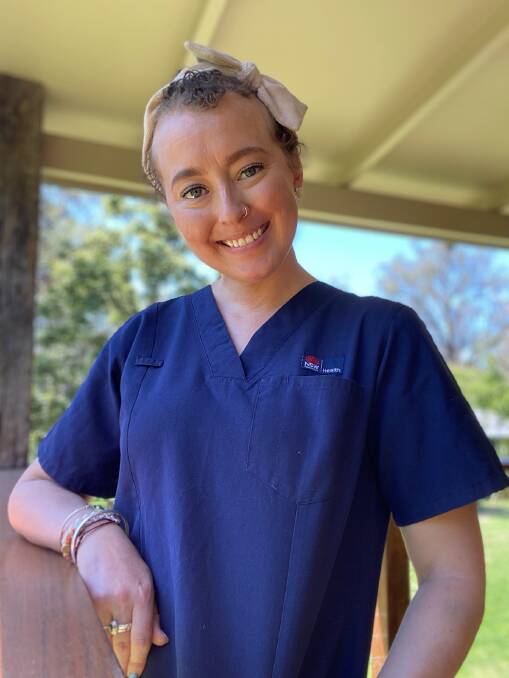 Courtney Hughes was excited to put on her scrubs and stand on the other side of the bed. Picture supplied Courtney Hughes was excited to put on her scrubs and stand on the other side of the bed. Picture supplied