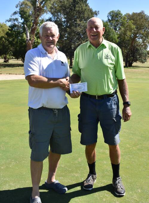 WINNER: Summer stableford winner Kevin Hoppe and Ron Page. Hoppe claimed victory despite the tough weather conditions.
