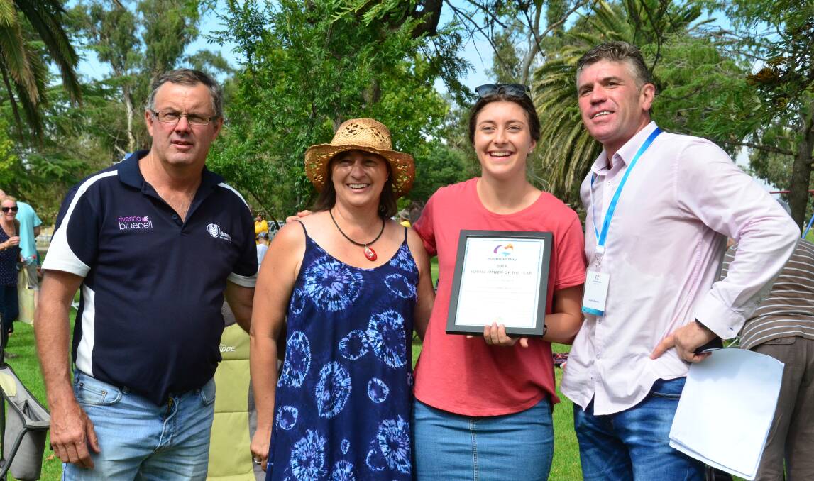 AWARD: Junior Citizen of the Year Emma James with her parents Rod and Cindy James and Australia Day Ambassador Mark Warren. Photo: Susie McDonell