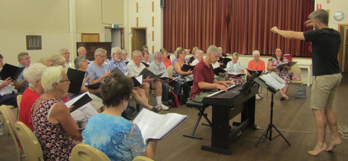 PRACTISE MAKES PERFECT: The Hilltops Choir rehearsing in the Uniting Church Hall in Young. Photo: Supplied