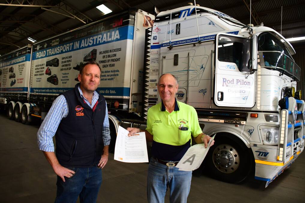 NO PROBLEMS: Rod Pilon Transport general manager Ben Pilon and truck driver Rod Hannifey haven't been held up at the border. Photo: BELINDA SOOLE